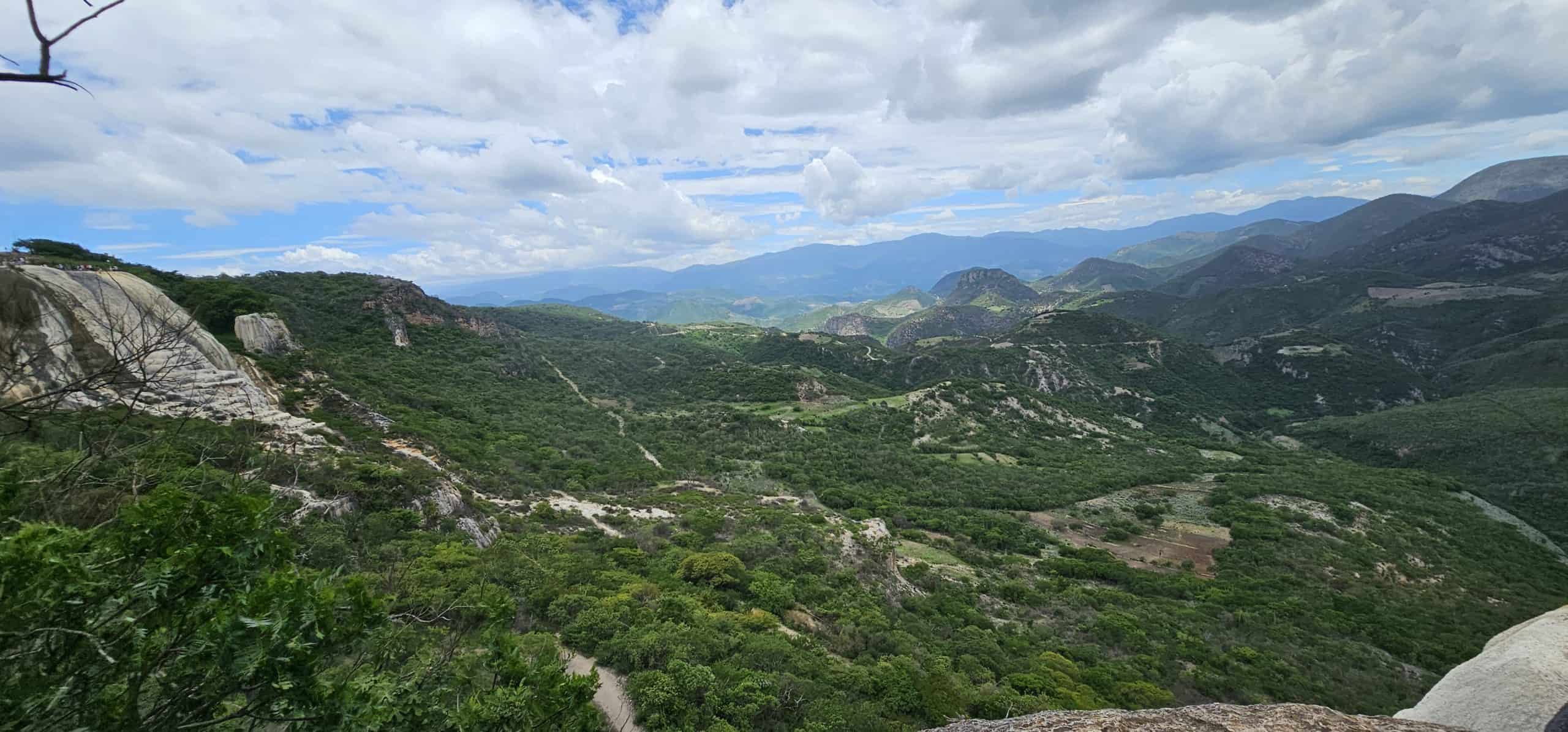 Oaxacan landsape of green mountains and Hierve de Agua. Photo taken during a day trip from Oaxaca