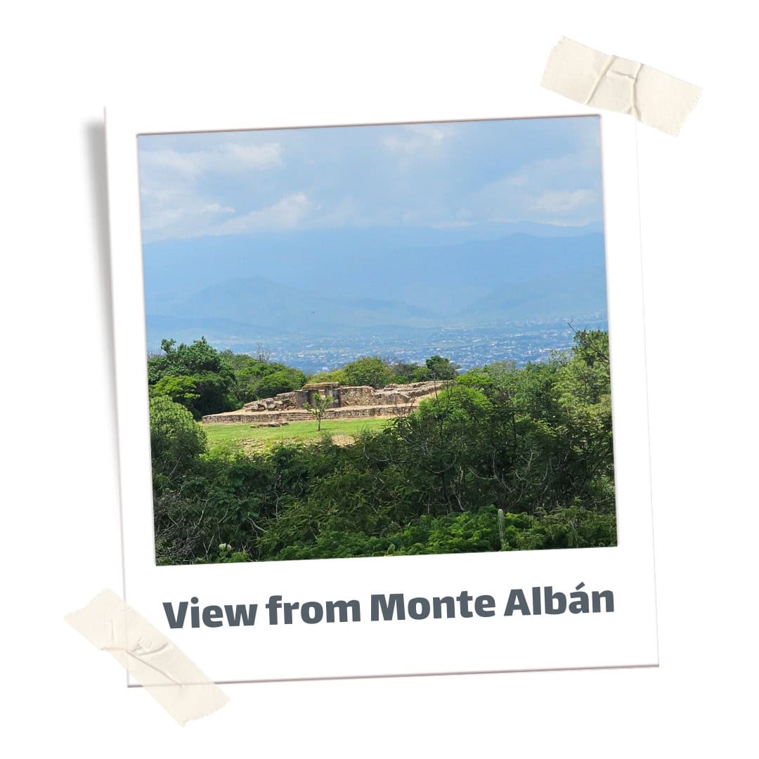 View from Monte Alban. A ruin and city and mountains in the distance during a day trip from Oaxaca