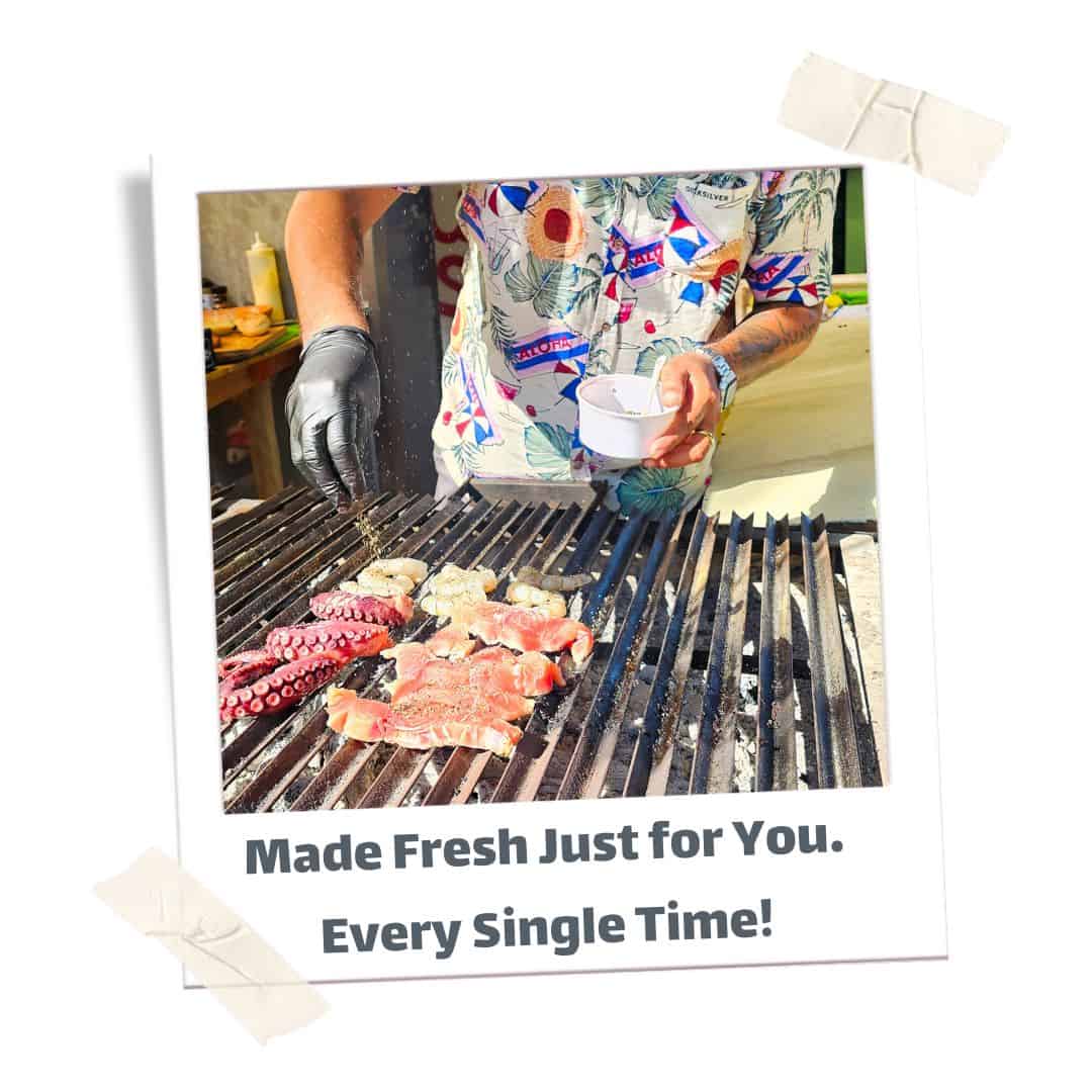 Meats grilling at Papu's food truck. 