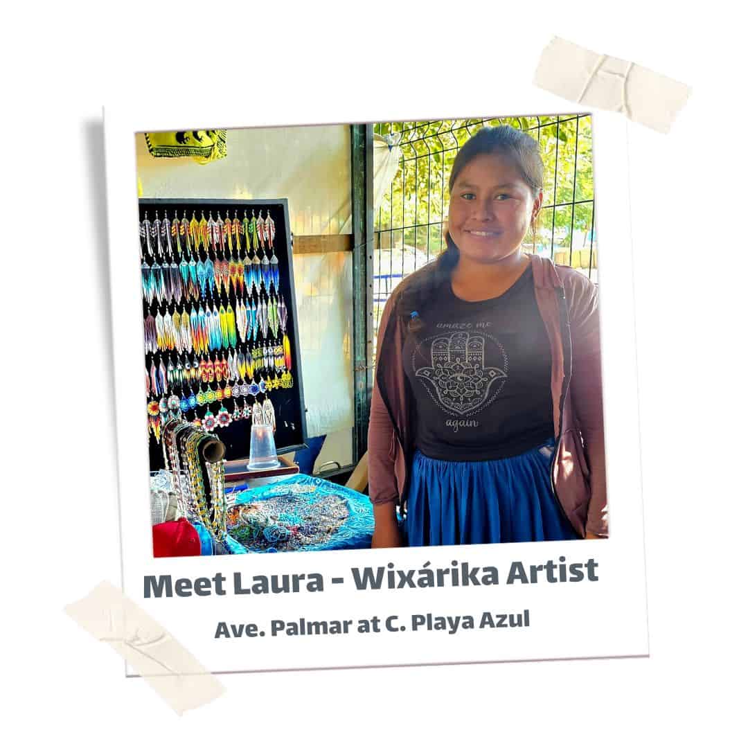 Young Indigenous woman standing in front of bead work. 
