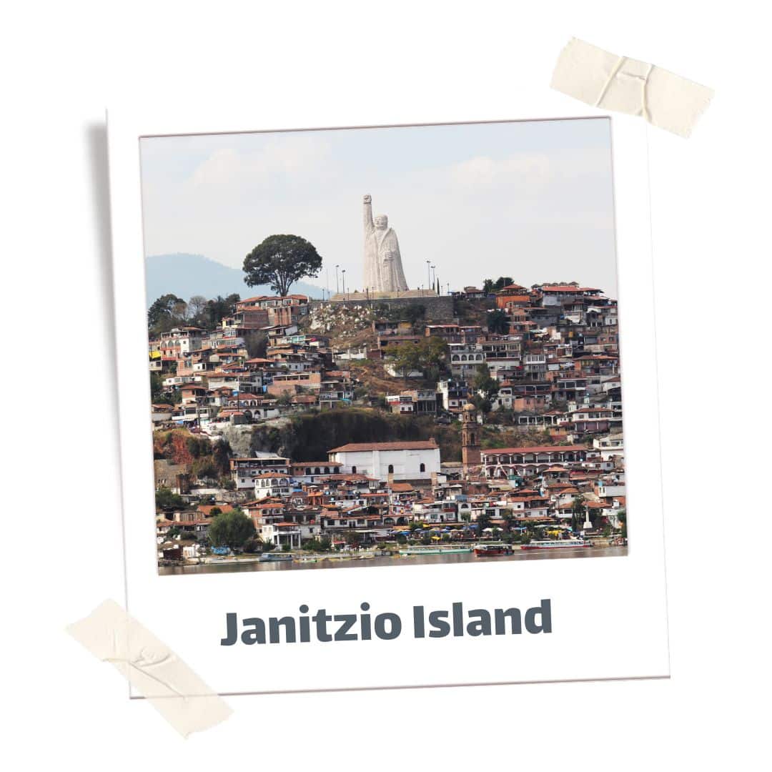 Janitizio Island covered in houses in Mexico. Add this to your Mexico itinerary, one of the best places to visit in mexico