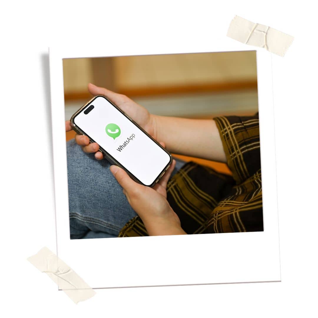 person holding a phone with whatsapp 