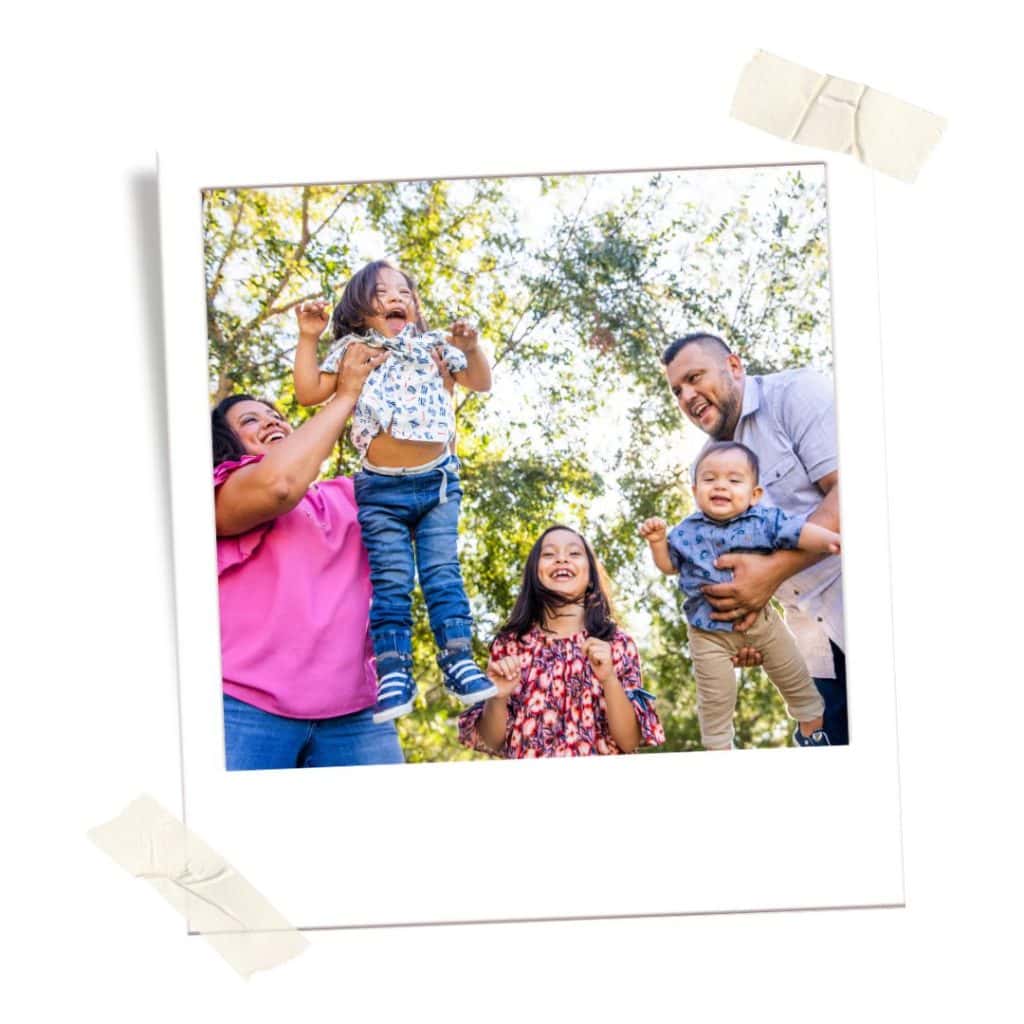 Mexican family playing at a park. 