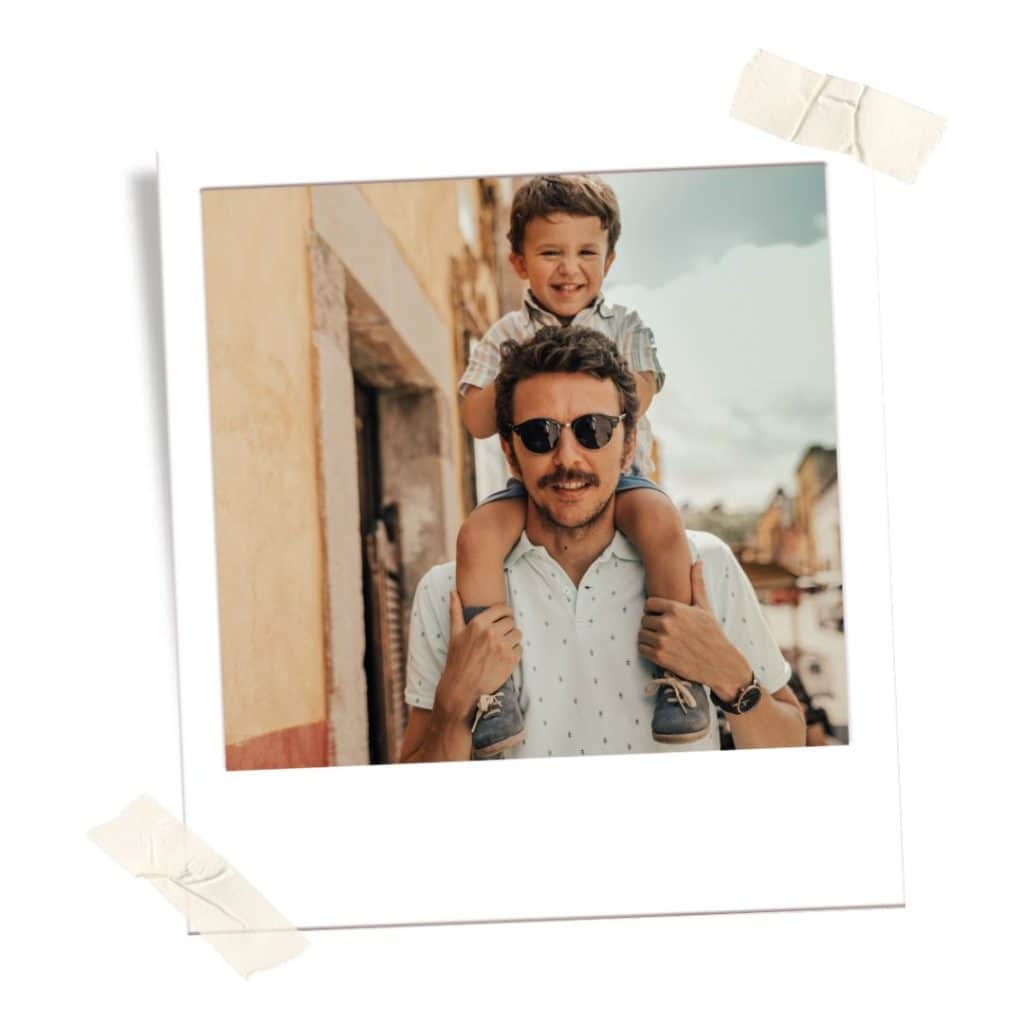 Father with child on shoulders in Mexico because its safe for families